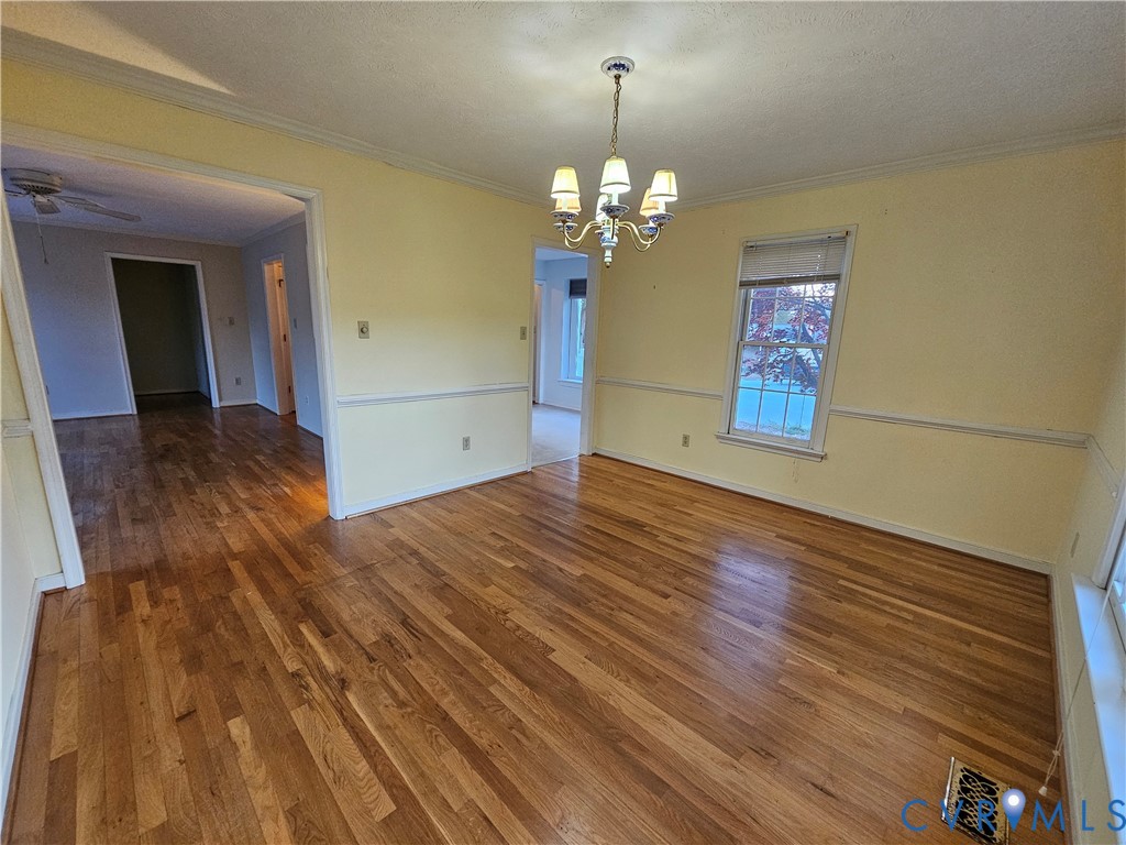 8002 Galaxie Circle Henrico, VA 23228 - Photo 20 of 49 a view of a room with wooden floor and chandelier