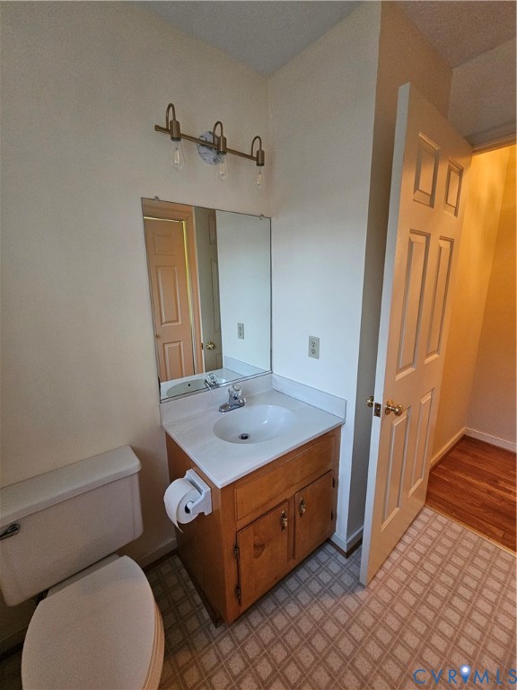8002 Galaxie Circle Henrico, VA 23228 - Photo 21 of 49 a bathroom with a toilet a sink and a mirror