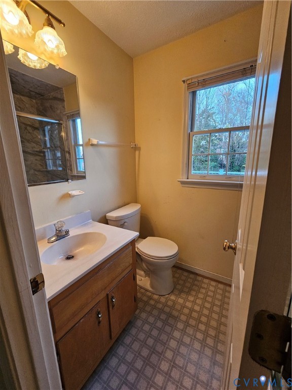 8002 Galaxie Circle Henrico, VA 23228 - Photo 27 of 49 a bathroom with a toilet sink and mirror