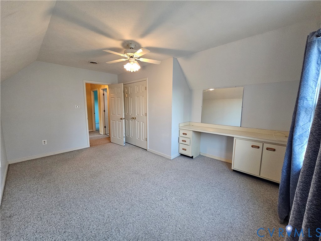 8002 Galaxie Circle Henrico, VA 23228 - Photo 38 of 49 an empty room with a ceiling fan and a bathroom