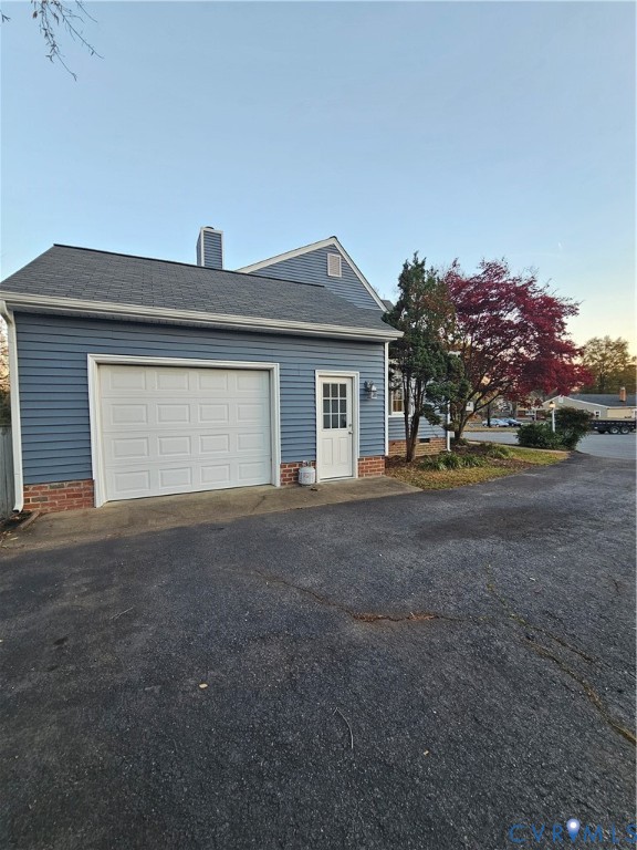 8002 Galaxie Circle Henrico, VA 23228 - Photo 6 of 49 View of property exterior with a chimney, asphalt