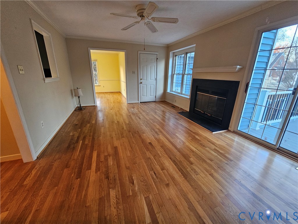 8002 Galaxie Circle Henrico, VA 23228 - Photo 8 of 49 a view of an empty room with wooden floor and a window