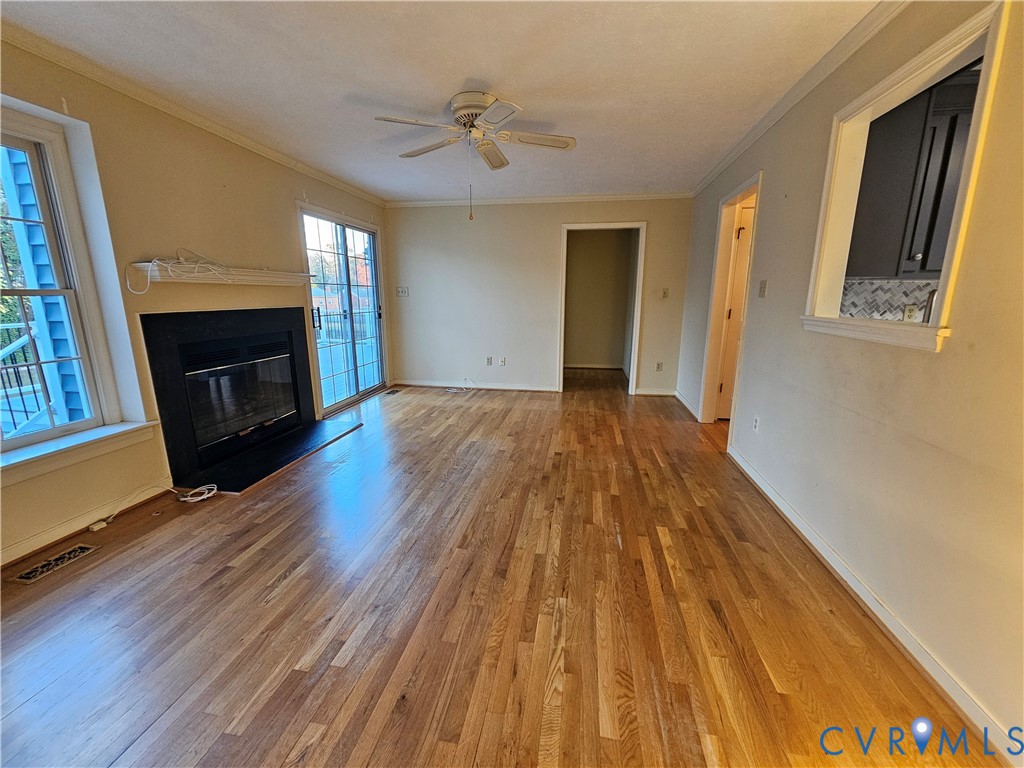 8002 Galaxie Circle Henrico, VA 23228 - Photo 10 of 49 Unfurnished living room featuring crown molding, a