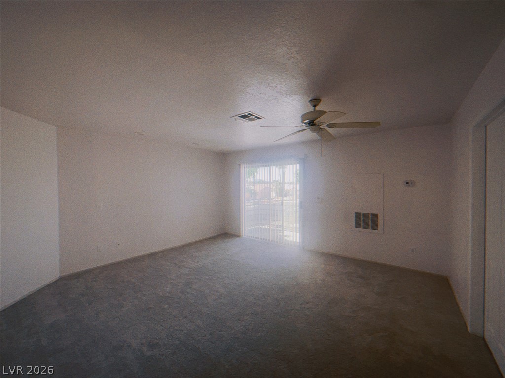 6250 West Flamingo Road, Unit 60 Las Vegas, NV 89103 - Photo 15 of 23 This living area offers a blank canvas with a sliding glass door and overhead fan for comfort.