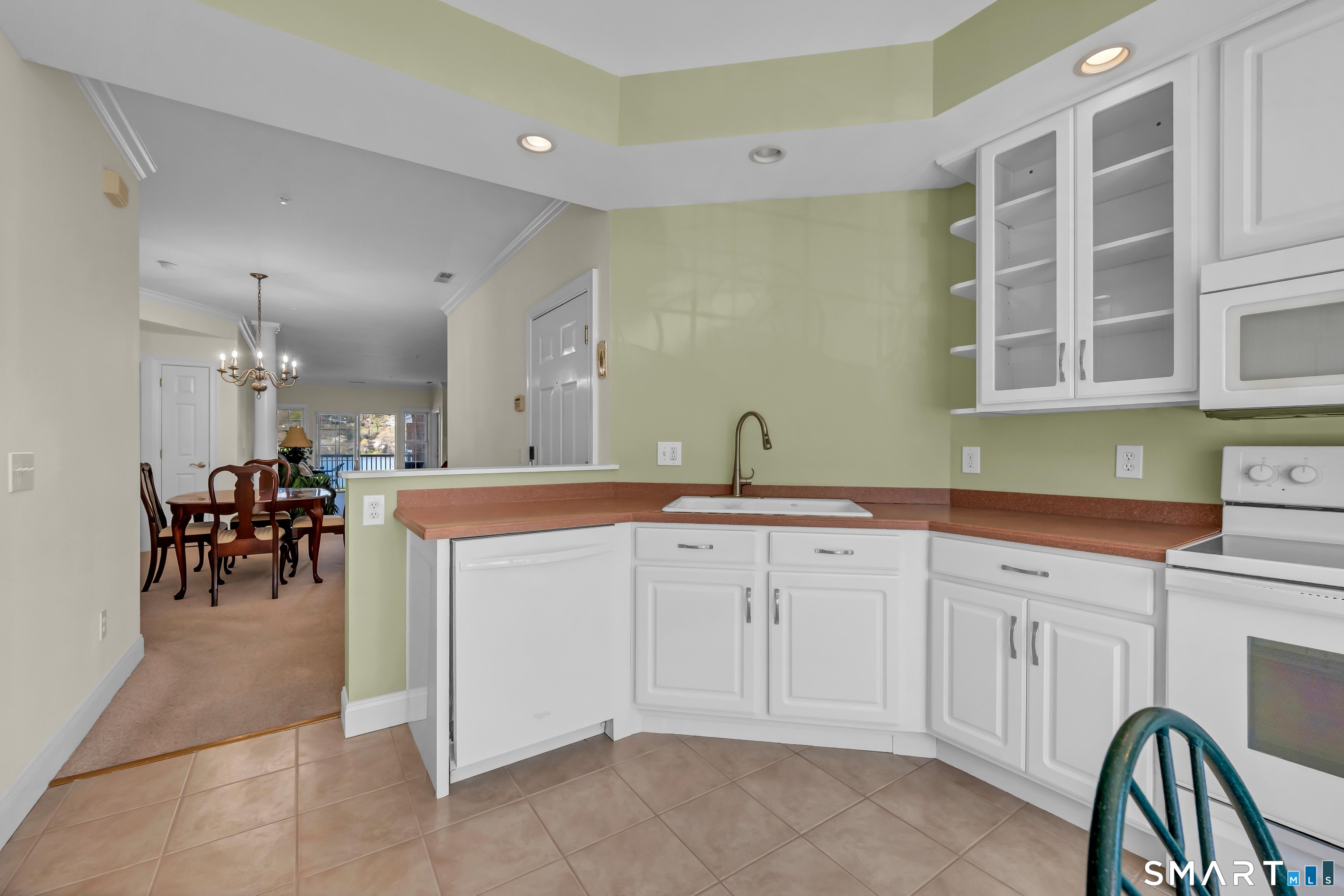 10 Hayestown Road, Unit 321 Danbury, CT 06811 - Photo 12 of 39 a spacious bathroom with a sink a table and a large mirror