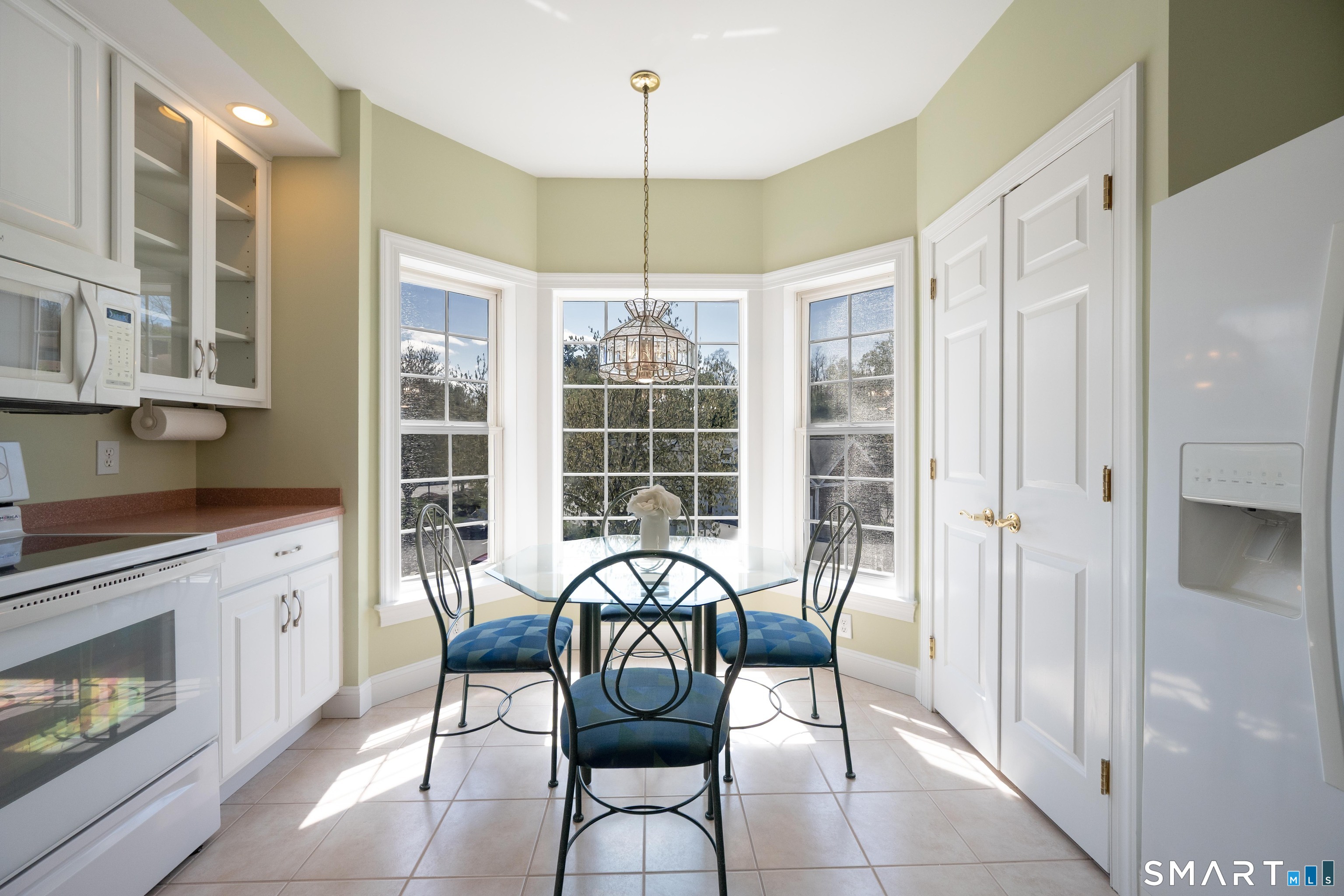 10 Hayestown Road, Unit 321 Danbury, CT 06811 - Photo 13 of 39 a view of a dining room with furniture window and outside view