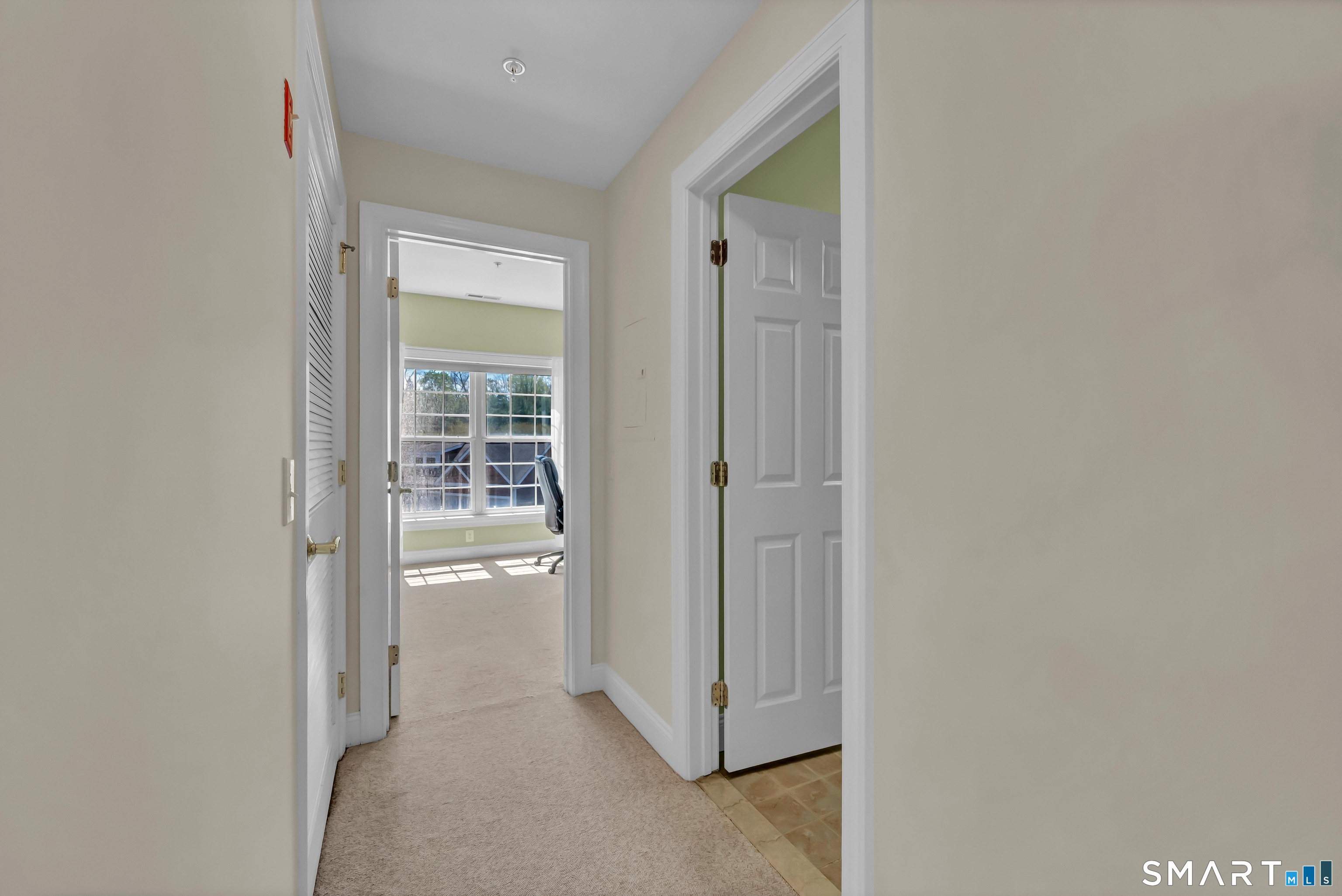10 Hayestown Road, Unit 321 Danbury, CT 06811 - Photo 25 of 39 a view of a hallway with wooden shelves