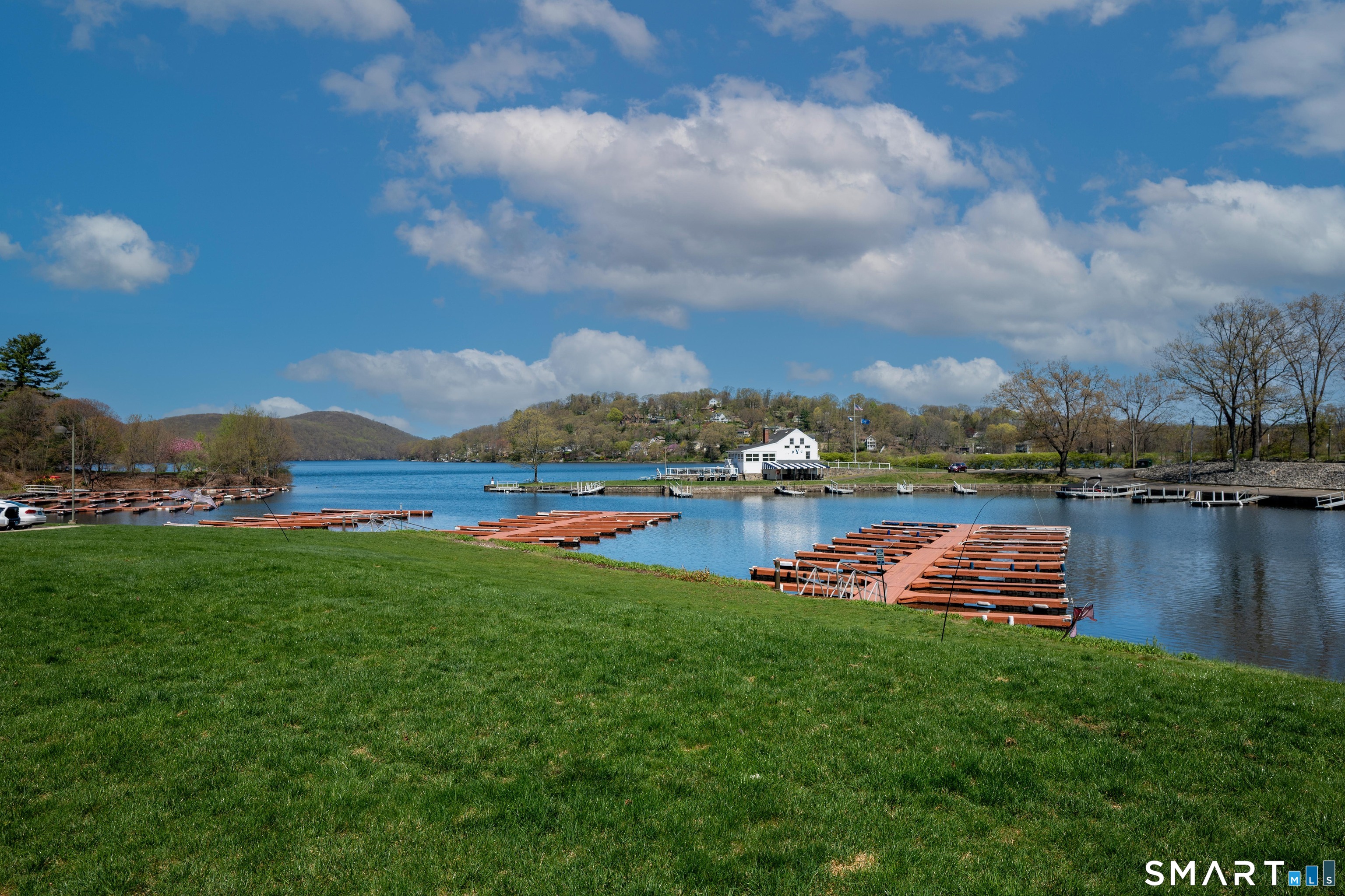 10 Hayestown Road, Unit 321 Danbury, CT 06811 - Photo 32 of 39 a view of a lake with houses in the back