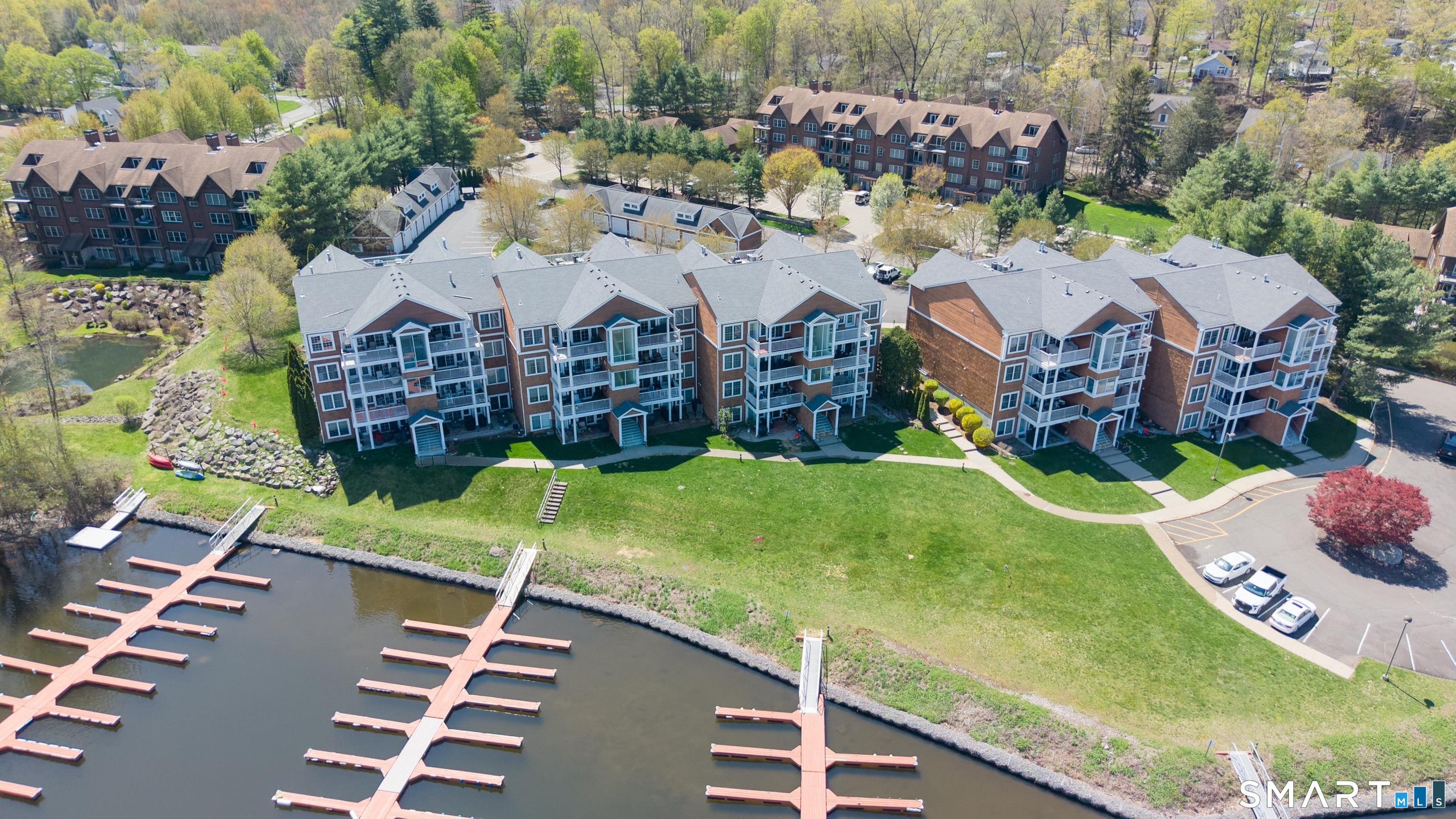 10 Hayestown Road, Unit 321 Danbury, CT 06811 - Photo 36 of 39 an aerial view of a house with garden space pool seating area and yard