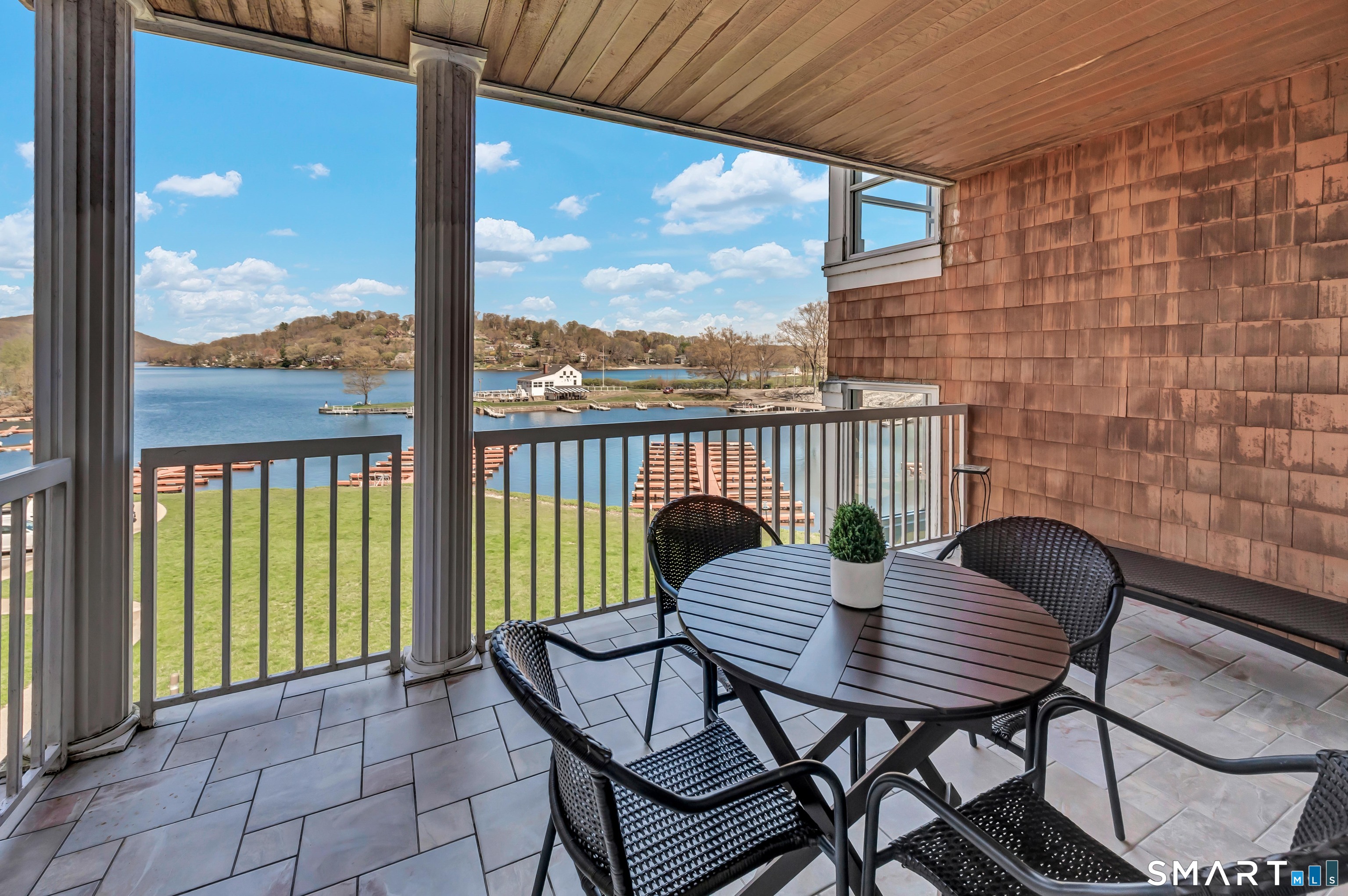 10 Hayestown Road, Unit 321 Danbury, CT 06811 - Photo 8 of 39 a view of a balcony with a table and chairs