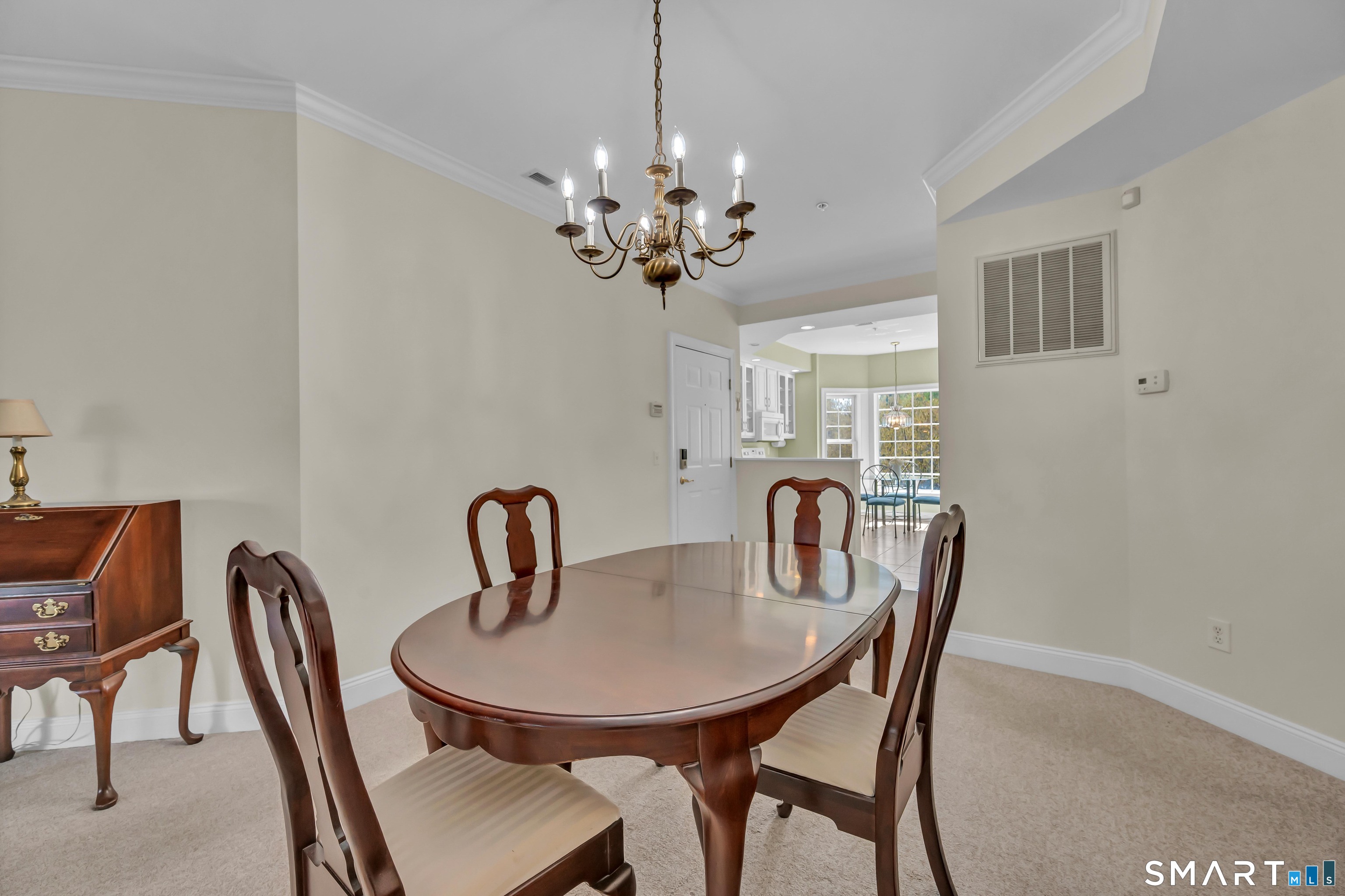 10 Hayestown Road, Unit 321 Danbury, CT 06811 - Photo 10 of 39 a dining room with furniture and chandelier