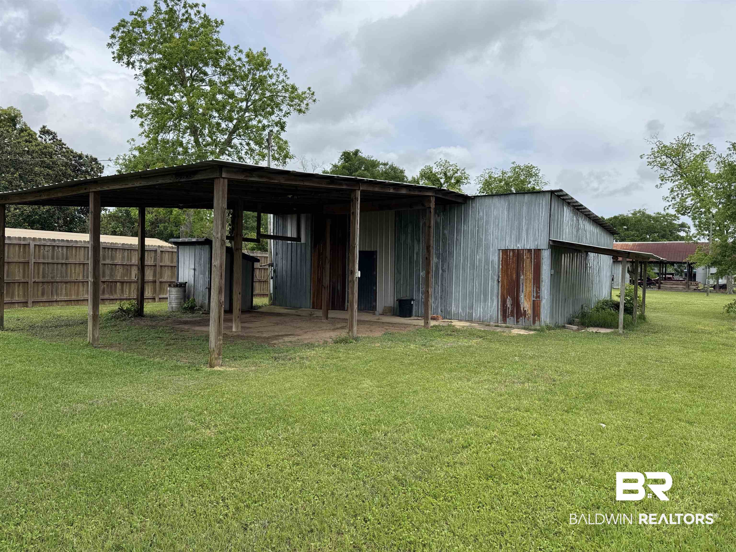 1104 North Pine Street Foley, AL 36535 - Photo 6 of 35 View of pole building with a carport