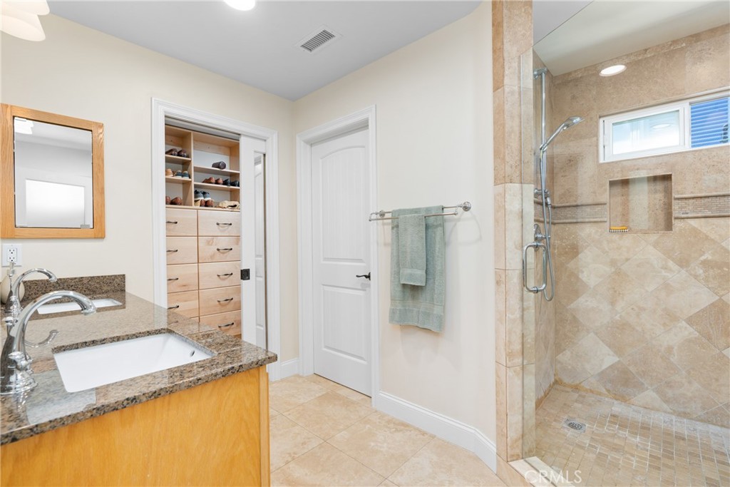 33872 Granada Drive Dana Point, CA 92629 - Photo 12 of 27 a bathroom with a sink and a mirror