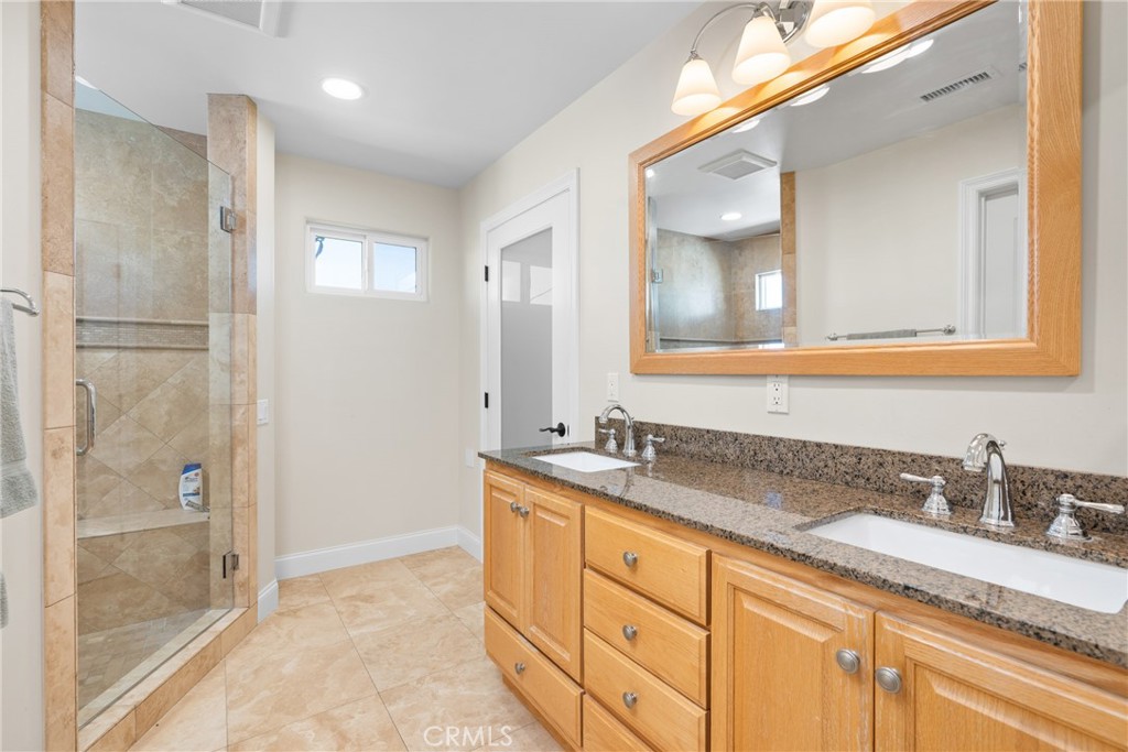 33872 Granada Drive Dana Point, CA 92629 - Photo 13 of 27 a bathroom with a granite countertop sink mirror and double