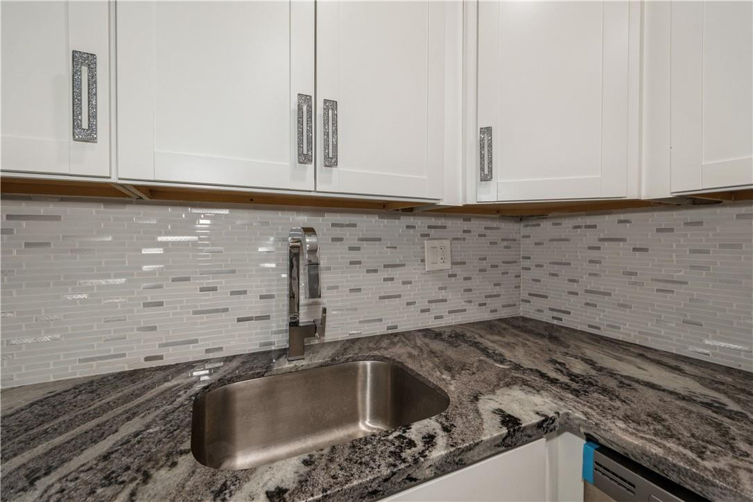 200 South Birch Road, Unit 612 Fort Lauderdale, FL 33316 - Photo 15 of 32 a kitchen with a sink and cabinets