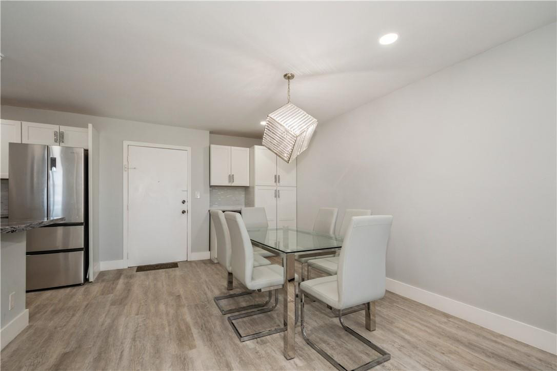 200 South Birch Road, Unit 612 Fort Lauderdale, FL 33316 - Photo 18 of 32 a view of a room with wooden floor and chairs