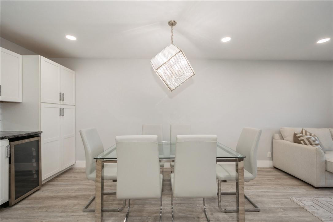 200 South Birch Road, Unit 612 Fort Lauderdale, FL 33316 - Photo 20 of 32 a view of a dining room with furniture and a chandelier