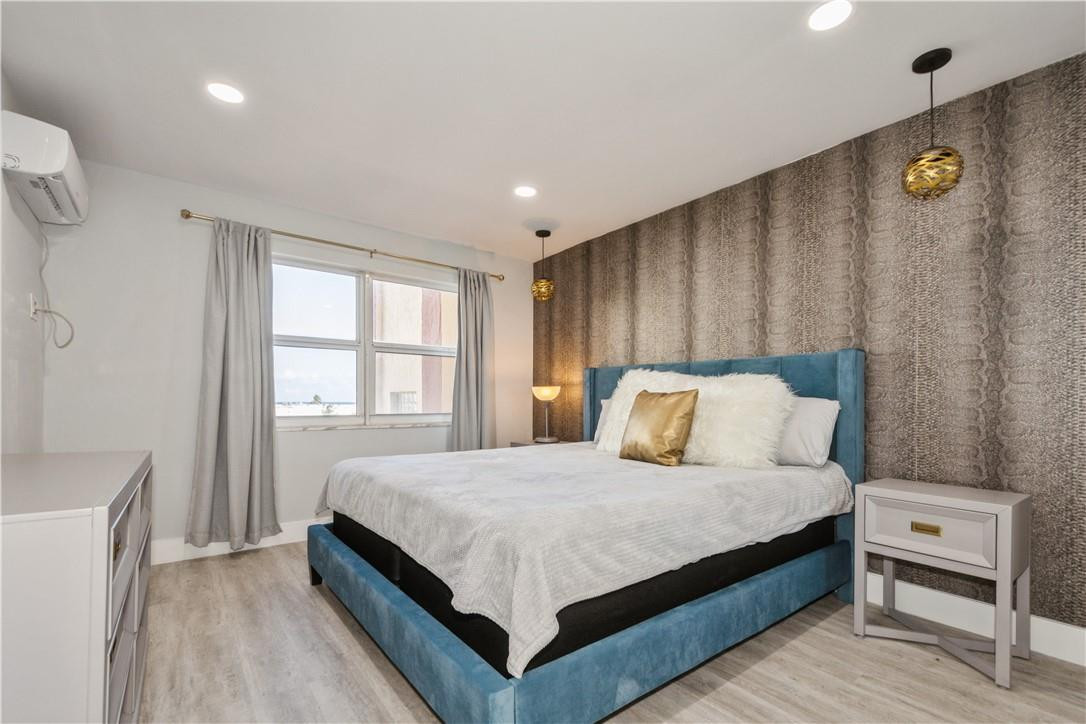 200 South Birch Road, Unit 612 Fort Lauderdale, FL 33316 - Photo 21 of 32 a bedroom with a bed and a window