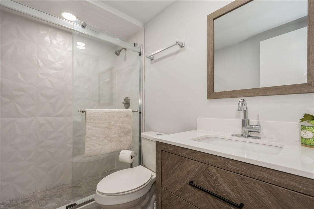200 South Birch Road, Unit 612 Fort Lauderdale, FL 33316 - Photo 25 of 32 a bathroom with a sink a toilet and shower