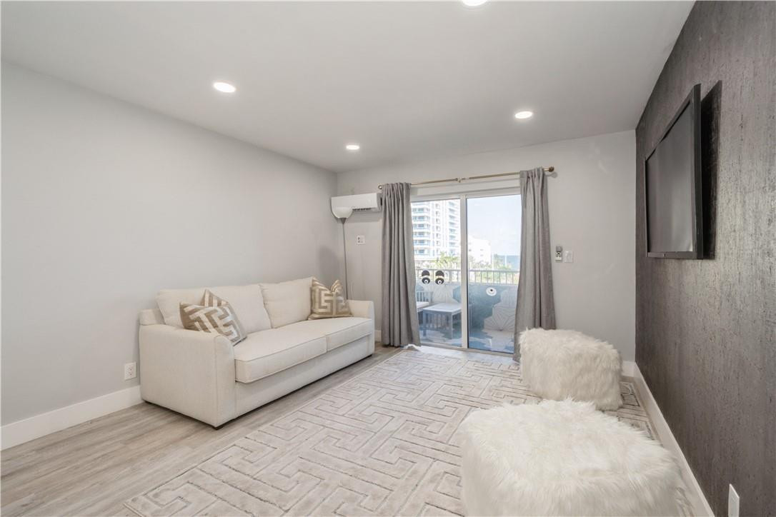 200 South Birch Road, Unit 612 Fort Lauderdale, FL 33316 - Photo 6 of 32 a spacious bedroom with a bed and a couch