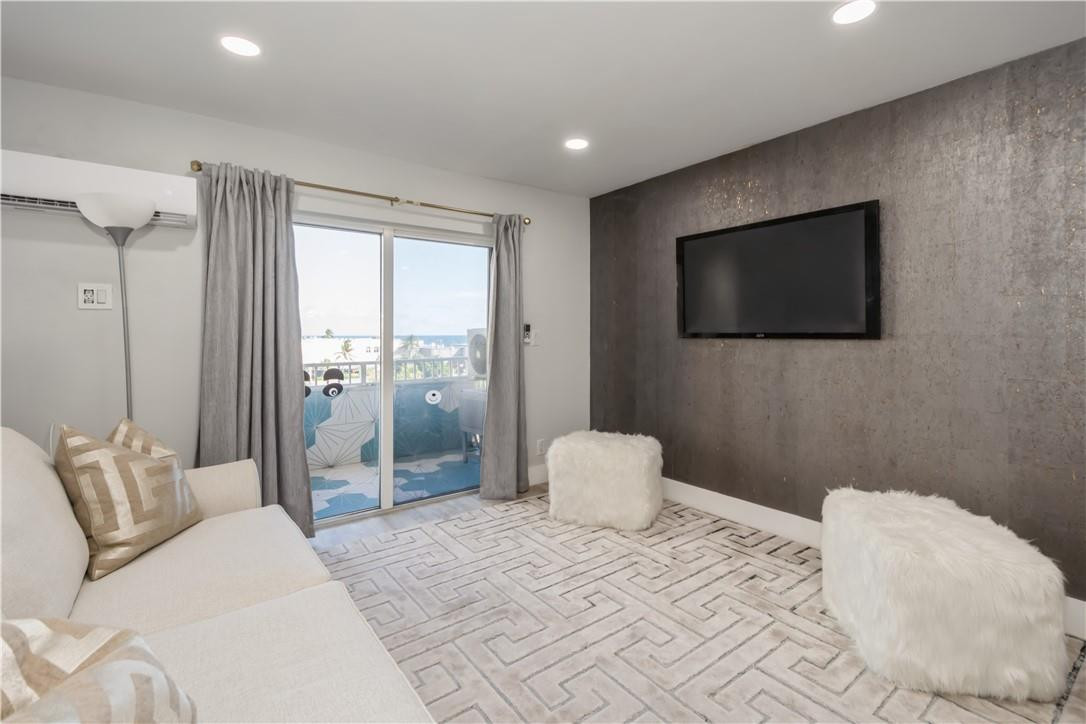 200 South Birch Road, Unit 612 Fort Lauderdale, FL 33316 - Photo 8 of 32 a bedroom with a bed and a flat screen tv