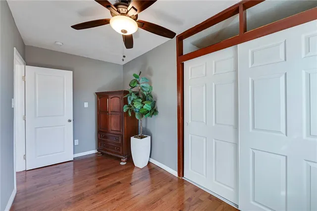 a bathroom with a sink mirror vanity and toilet