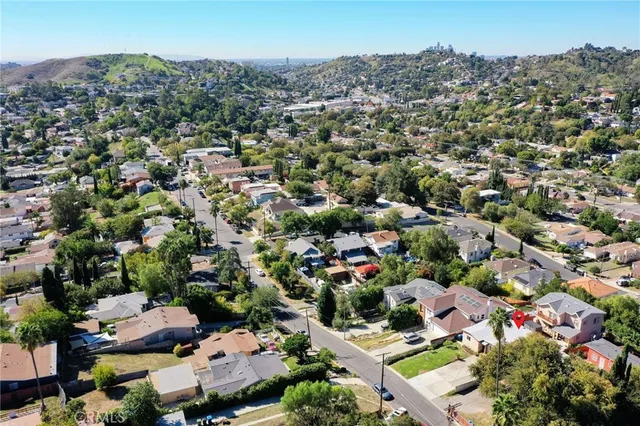 a front view of a house with a yard and outdoor seating