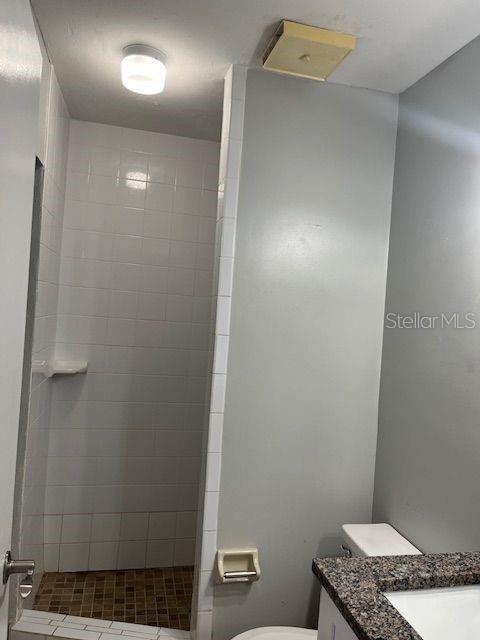 3600 Southwest 19th Avenue, Unit 41D Gainesville, FL 32607 - Photo 12 of 23 a bathroom with a granite countertop sink and a toilet