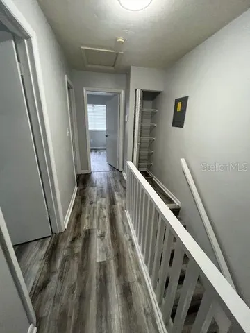 a bed sitting in a room next to a window