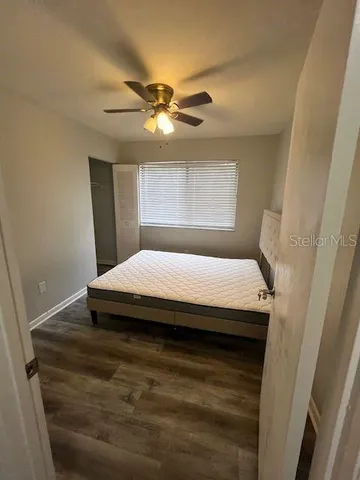 a bed sitting in a room next to a window