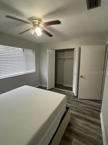 a view of a balcony with a ceiling fan