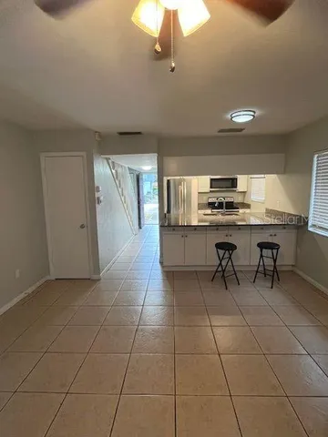 a kitchen with stainless steel appliances a sink a counter top space cabinets and counter space