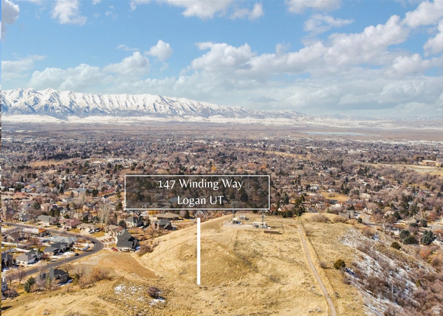 147 Winding Way, Unit 50 Logan, UT 84321 - Photo 15 of 16 Aerial view of residential area featuring property boundaries highlighted and a mountainous background
