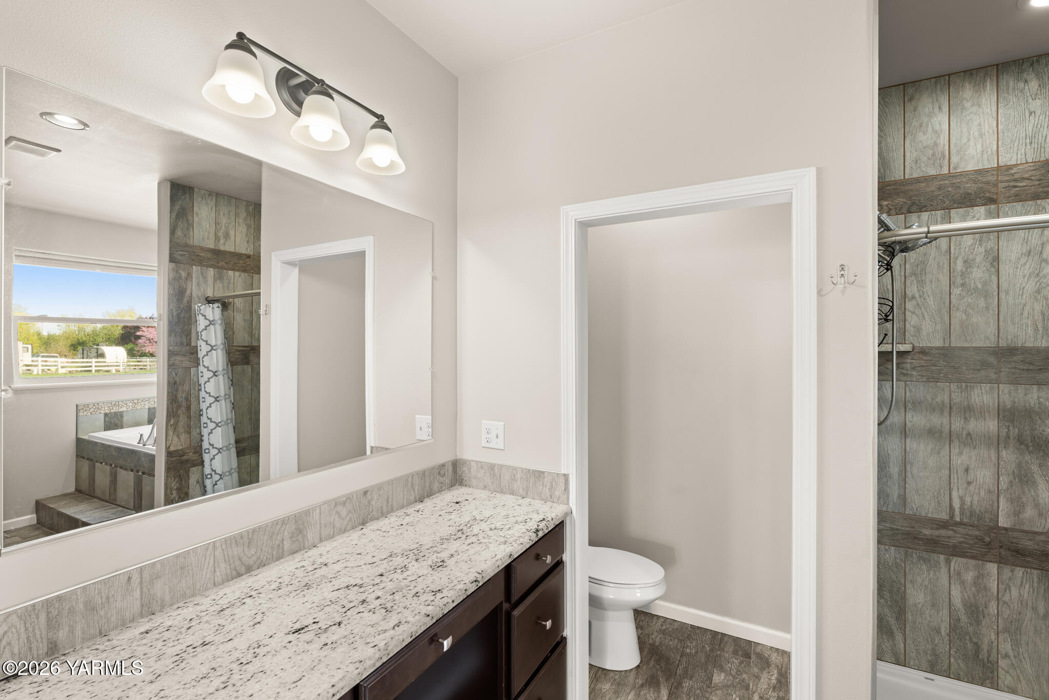 11625 Missimer Road Prosser, WA 99350 - Photo 22 of 40 a bathroom with a granite countertop sink toilet and shower