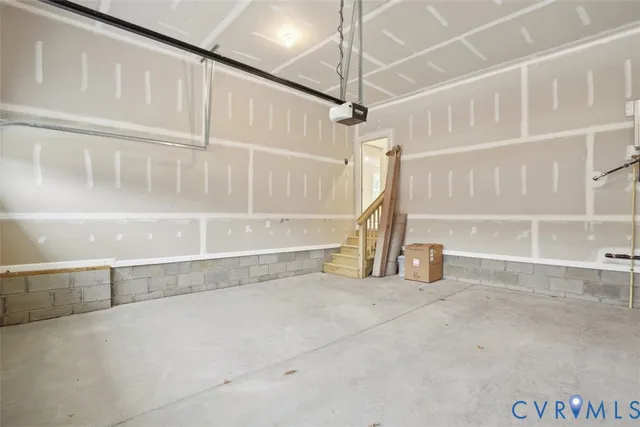 a view of staircase with white walls and a window