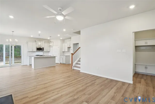 a view of kitchen with wooden floor and window
