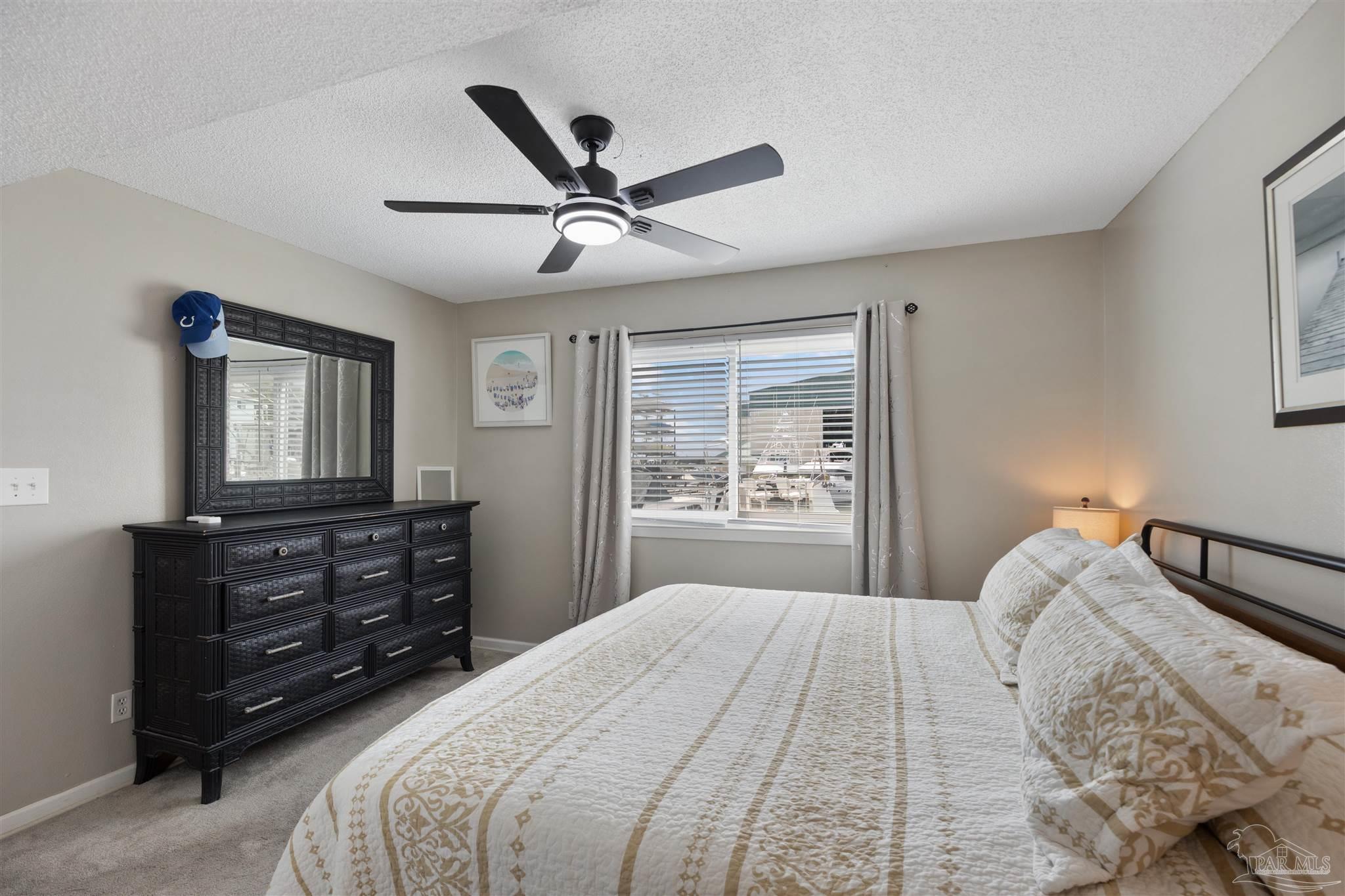 14100 River Road, Unit 122B Perdido Key, FL 32507 - Photo 26 of 46 a bedroom with a bed and a window