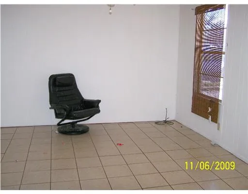a kitchen with a sink a stove and cabinets