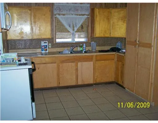 an empty room with wooden floor