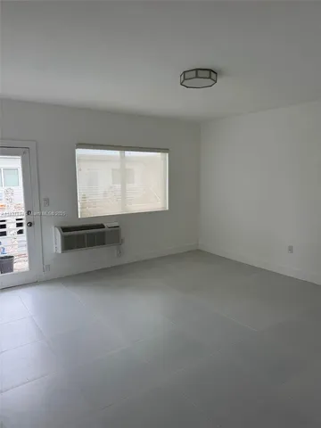 a kitchen with a sink stove and refrigerator