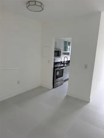 a bathroom with a shower a toilet and a sink