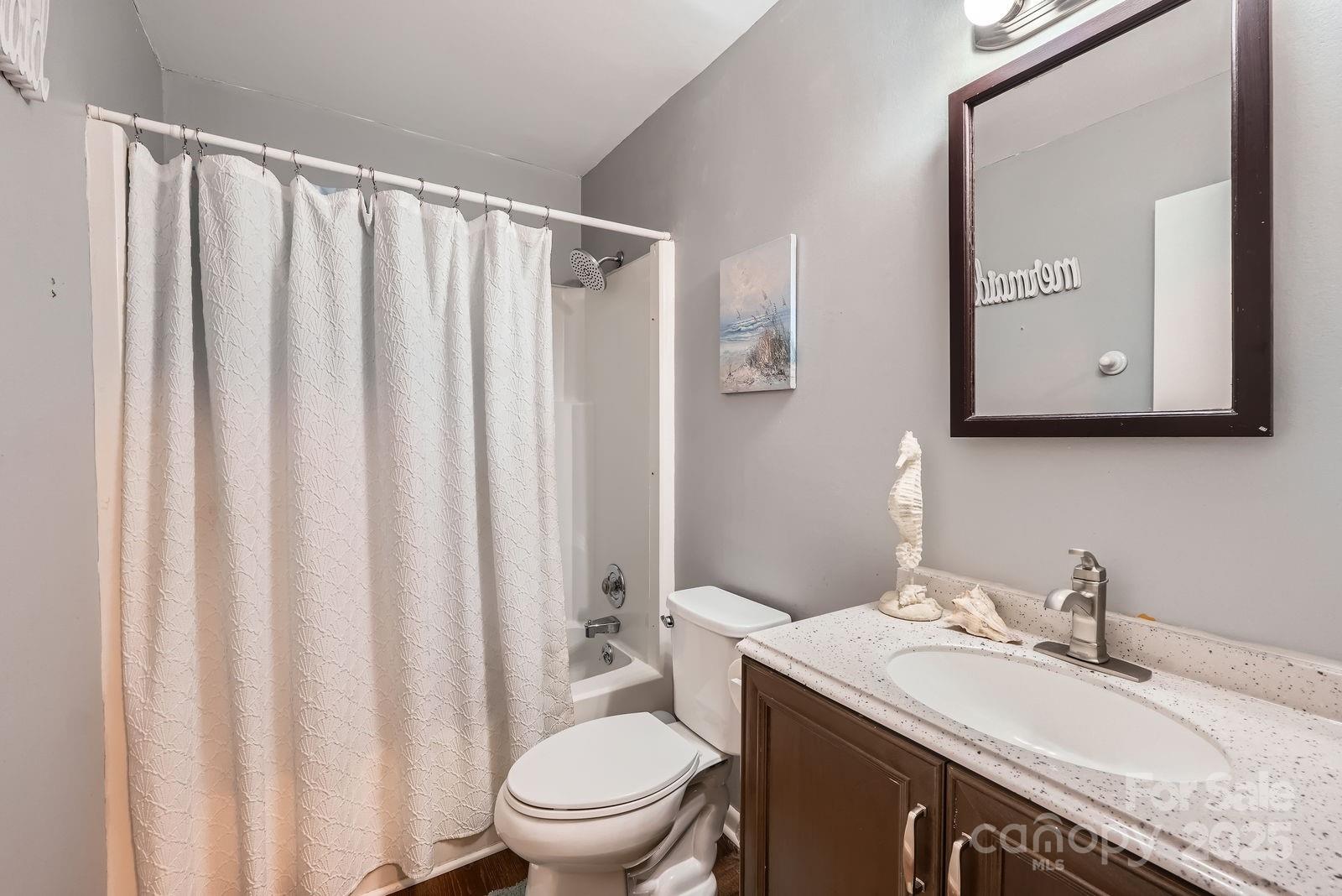 2009 Pinevalley Road Rock Hill, SC 29732 - Photo 21 of 27 a bathroom with a granite countertop sink toilet and mirror