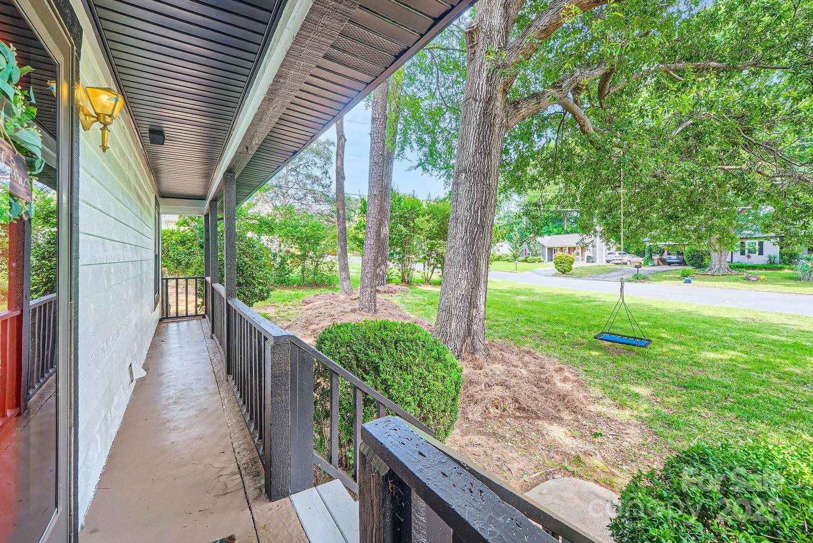 2009 Pinevalley Road Rock Hill, SC 29732 - Photo 4 of 27 a view of a porch with a big yard potted plants and large tree