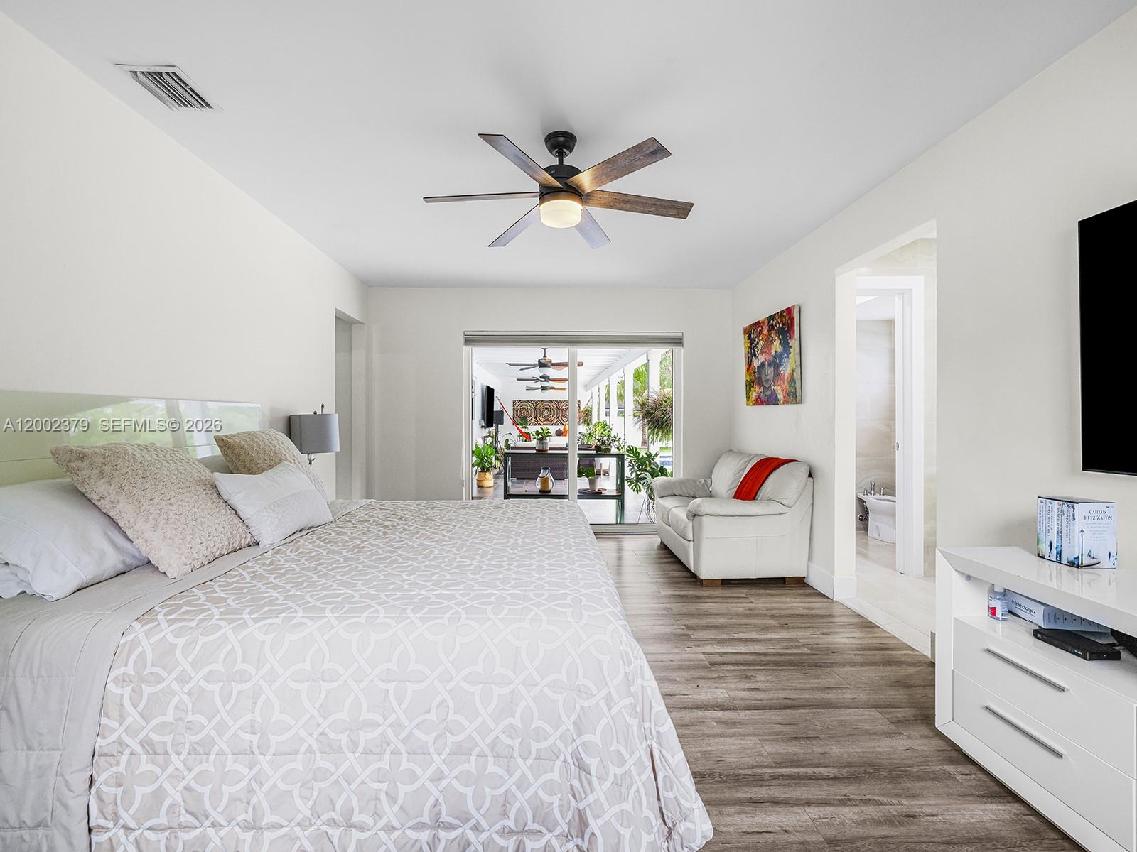 7495 Southwest 73rd Terrace Miami, FL 33143 - Photo 11 of 33 a bedroom with furniture and a chandelier fan