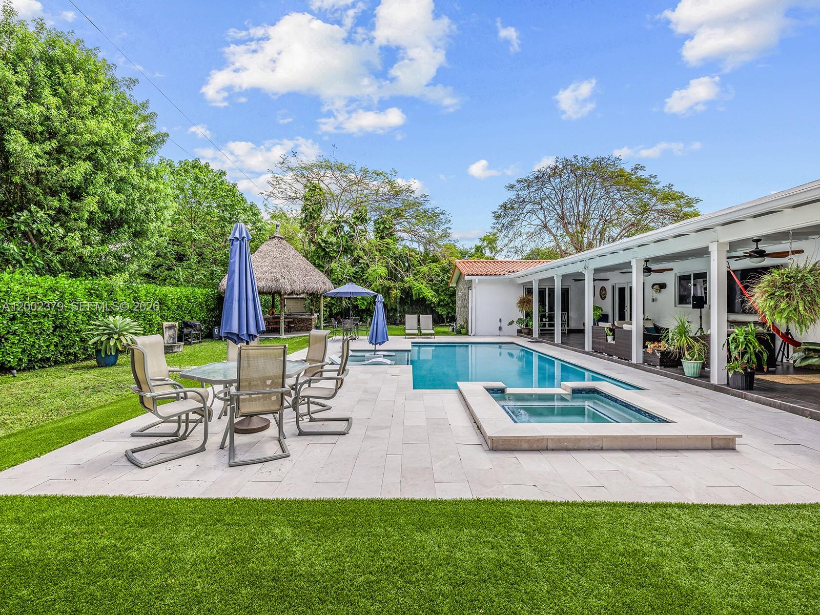 7495 Southwest 73rd Terrace Miami, FL 33143 - Photo 14 of 33 a view of house with a backyard porch and sitting area