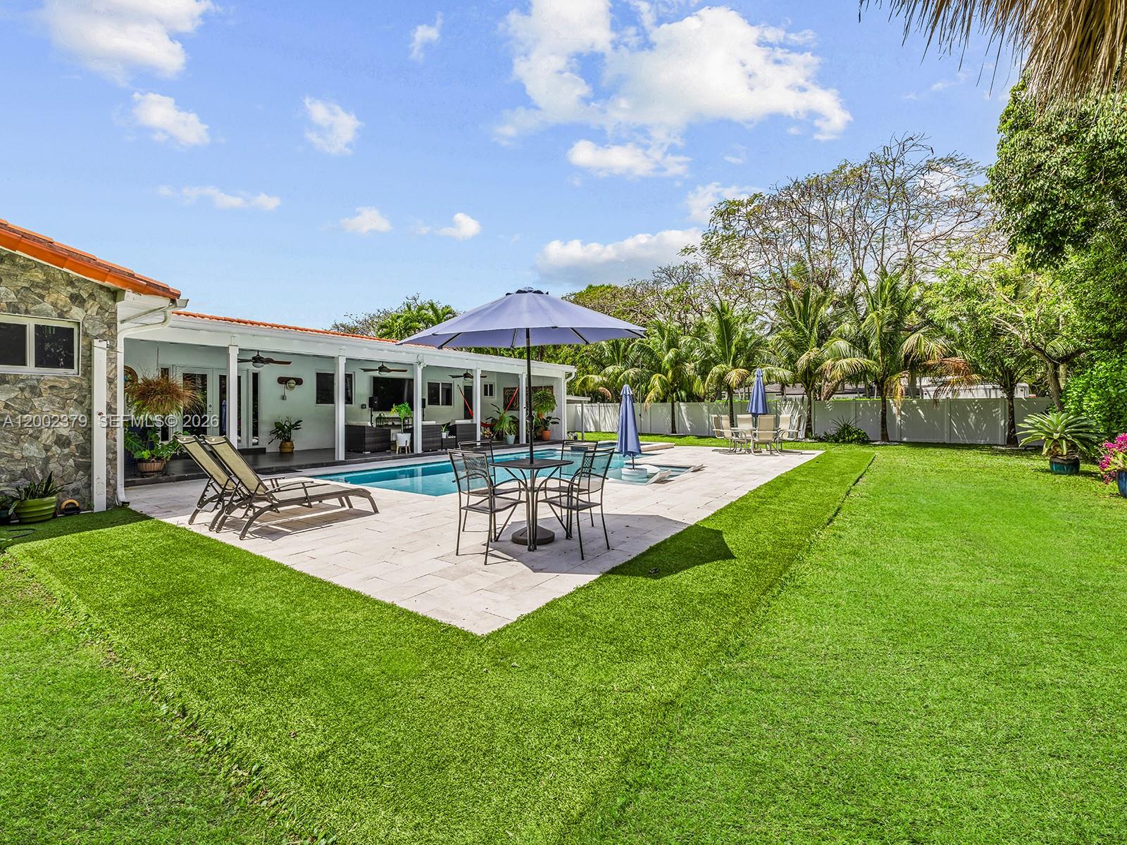 7495 Southwest 73rd Terrace Miami, FL 33143 - Photo 16 of 33 a view of house with backyard and outdoor seating