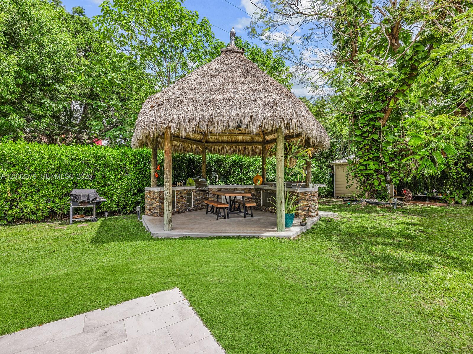 7495 Southwest 73rd Terrace Miami, FL 33143 - Photo 19 of 33 a view of a chair and table of the garden