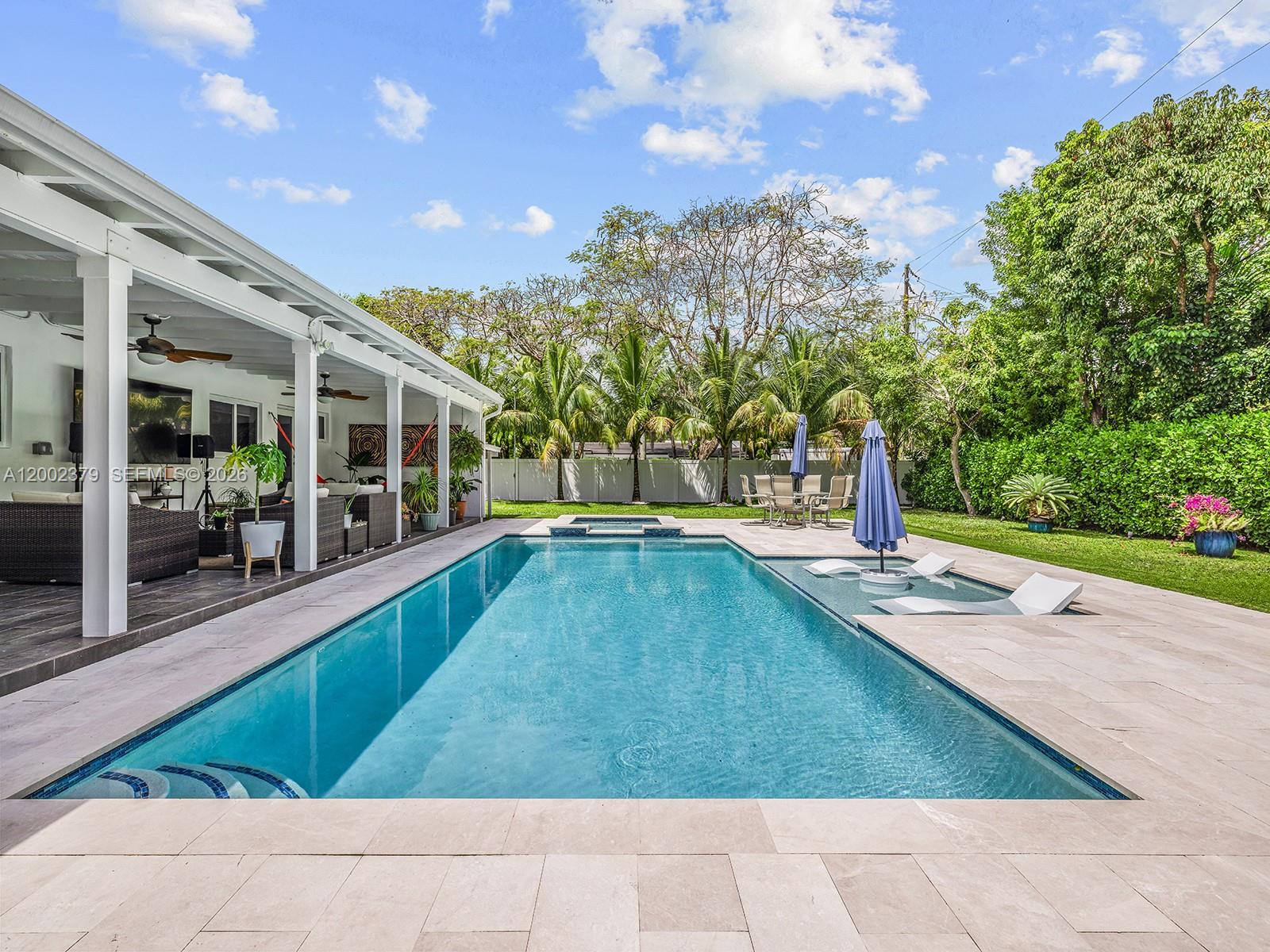 7495 Southwest 73rd Terrace Miami, FL 33143 - Photo 20 of 33 a view of a swimming pool with a yard