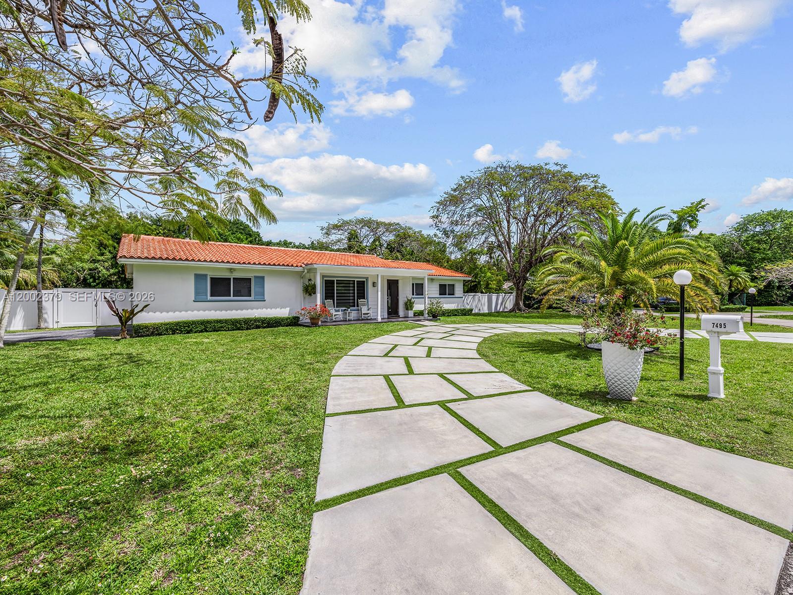 7495 Southwest 73rd Terrace Miami, FL 33143 - Photo 2 of 33 a view of house with a yard