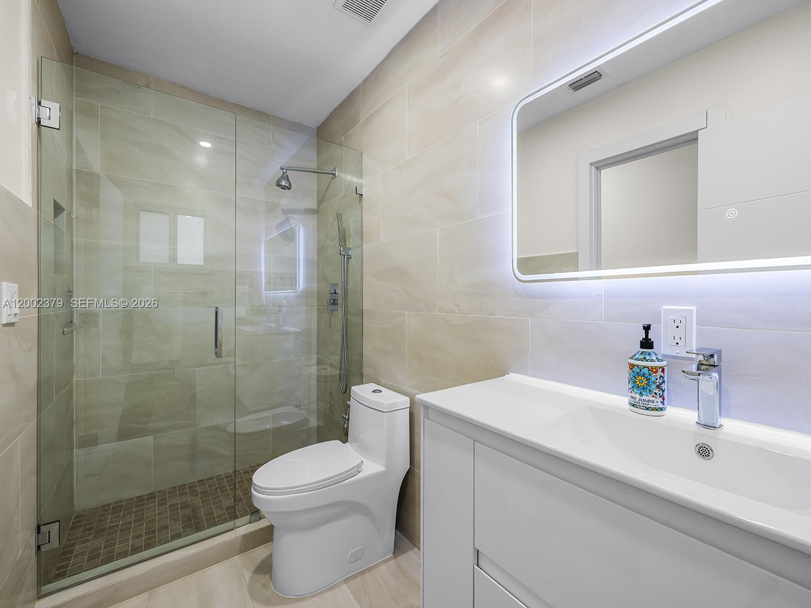 7495 Southwest 73rd Terrace Miami, FL 33143 - Photo 24 of 33 a bathroom with a sink a toilet and shower